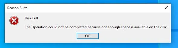 A "Reason Suite" dialog box with a red error icon stating "Disk Full" because not enough space is available on the disk.